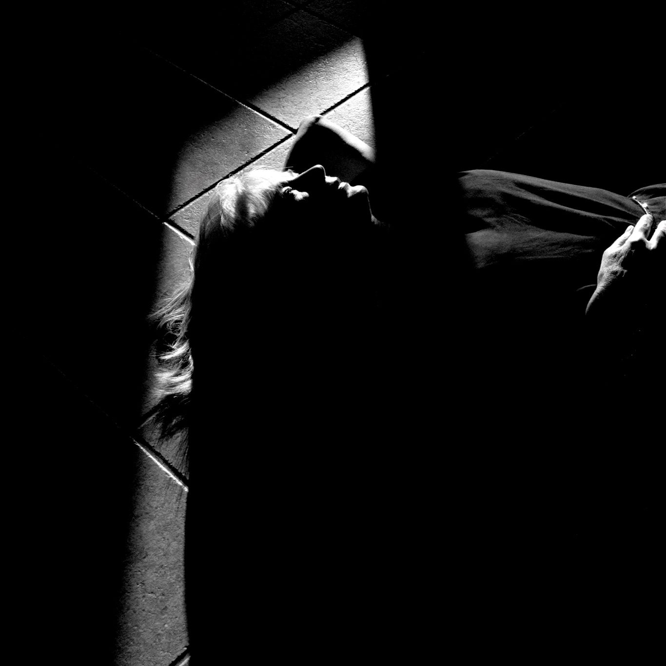 A girl lying on the ground thinking. Black and White photo